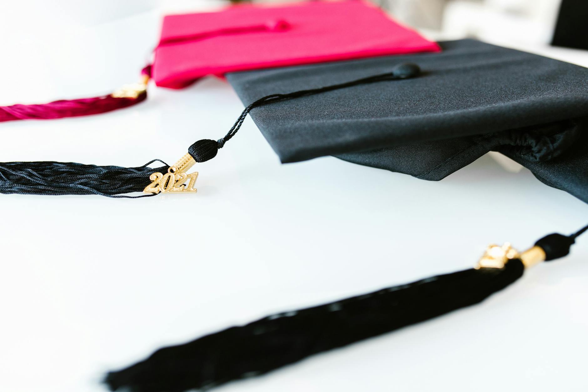 black graduation cap on white table